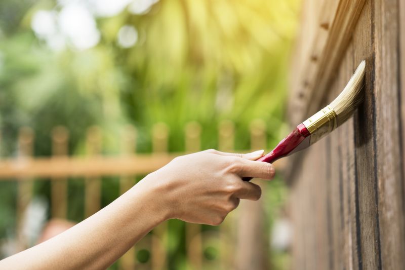 Painting Fence in Summer