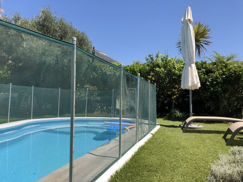 Mesh Fence with Pool in Background